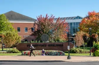 Student walking across campus